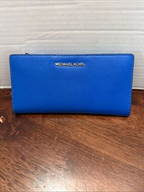 Michael Kors women’s Zip-Around Wallet in Cobalt Blue with Gold Logo